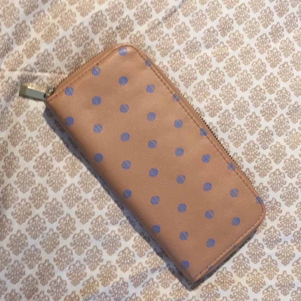 Tan wallet with blue dots.